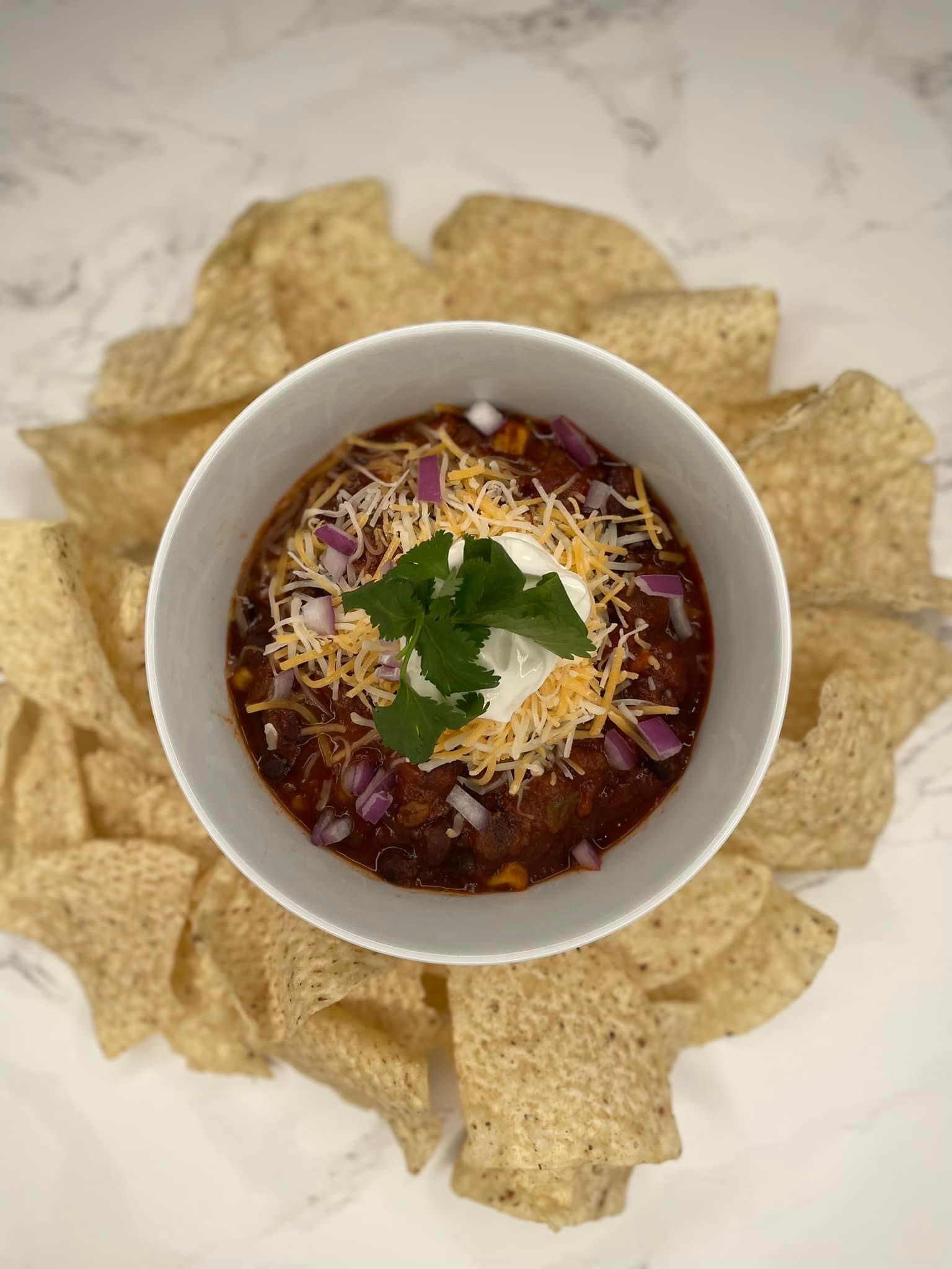 Bowl of taco chili with tortilla chips