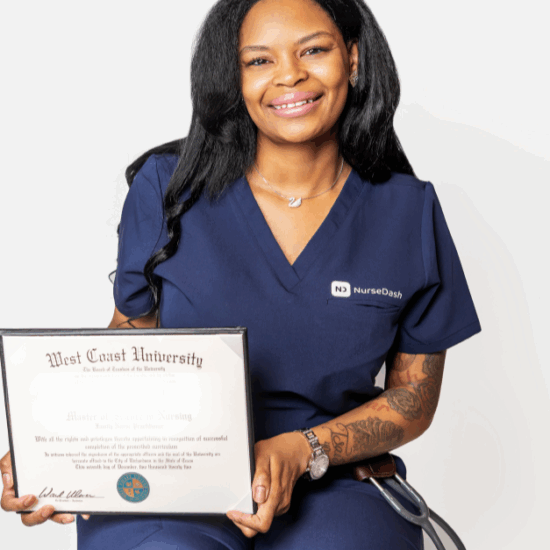 Nurse in blue scrubs holding graduation diploma